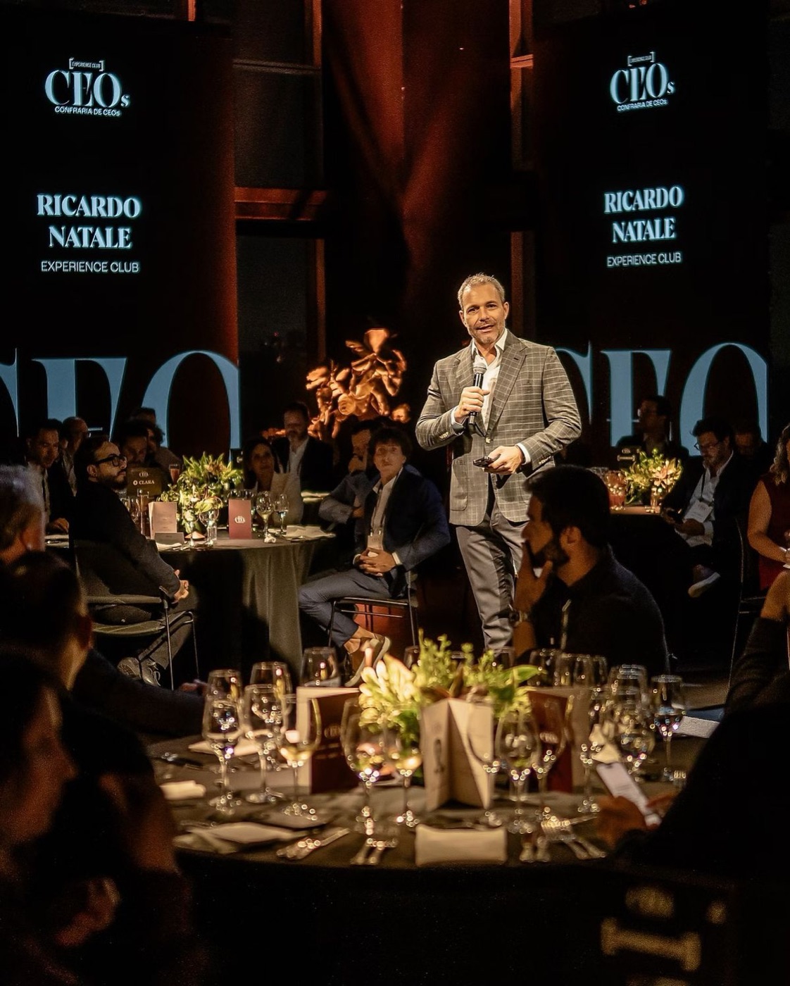 Seated gala dinner with a speaker on the floor