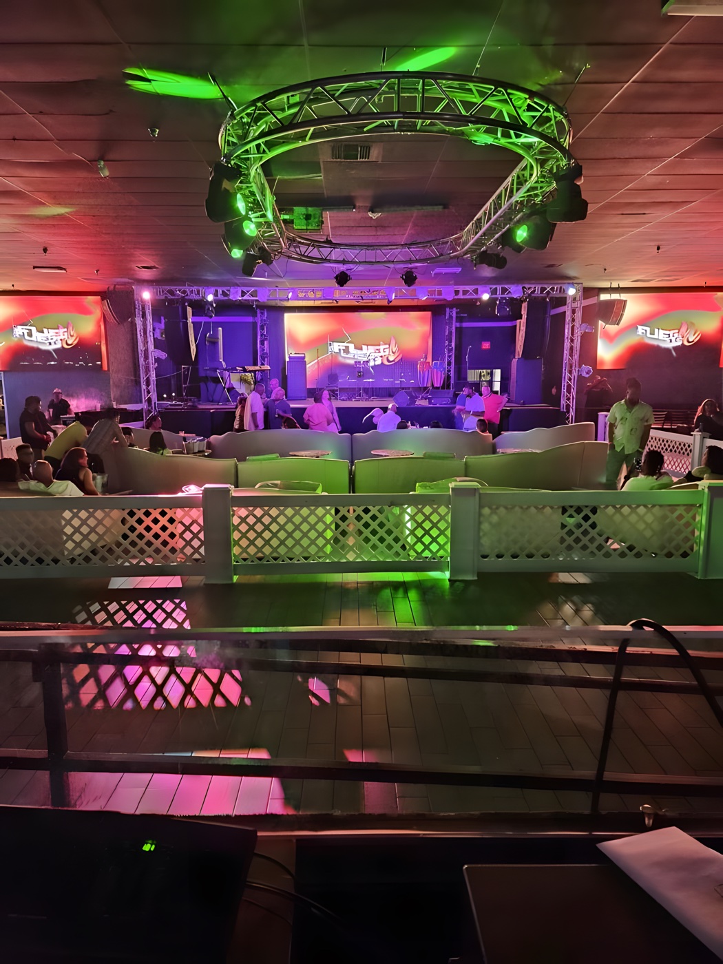 VIP seating beneath the circular lighting truss